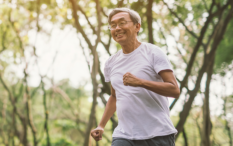 An senior man jogging outdoors, showcasing the positive outcomes and high-quality care provided by Pivot Rehabilitation. The therapy services aim to enhance patient health and well-being through experienced and caring clinicians.